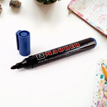 Permanent blue marker pens displayed neatly in a pack