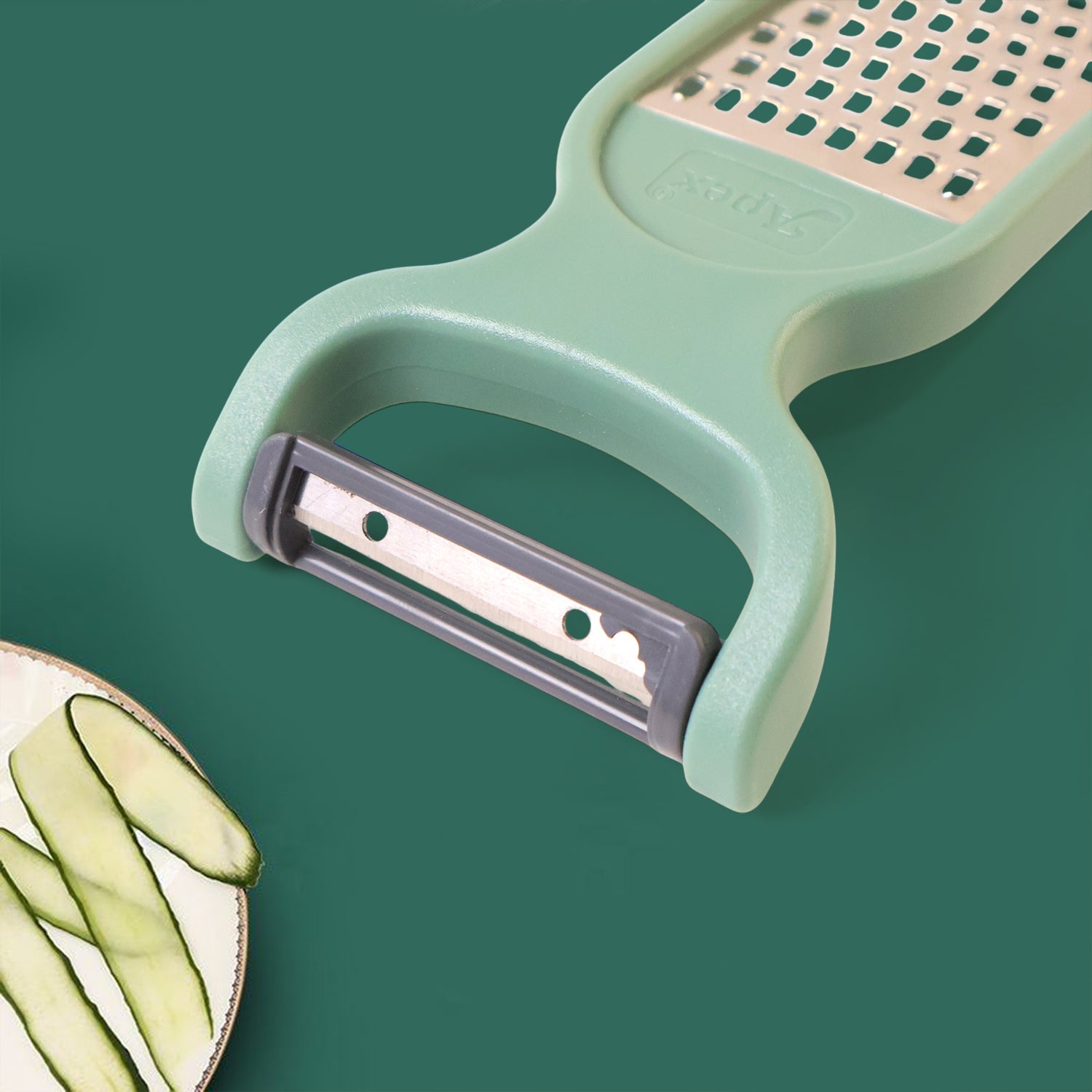 Close-up of vegetable grater blade and peeler side showing stainless steel edge
